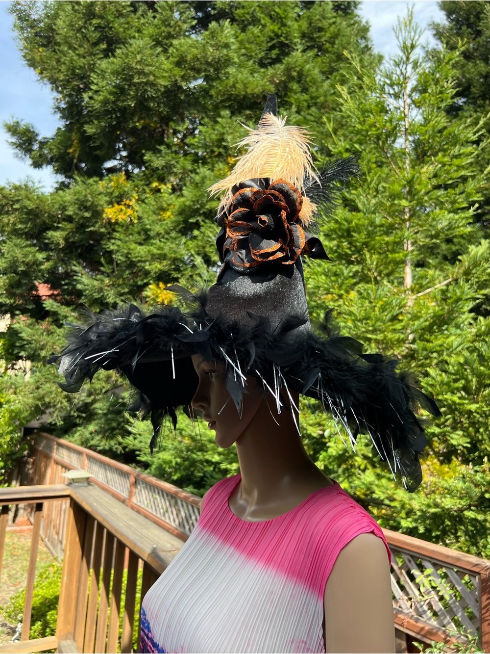 Black Feathered Witch Hat with Orange Flower Accent